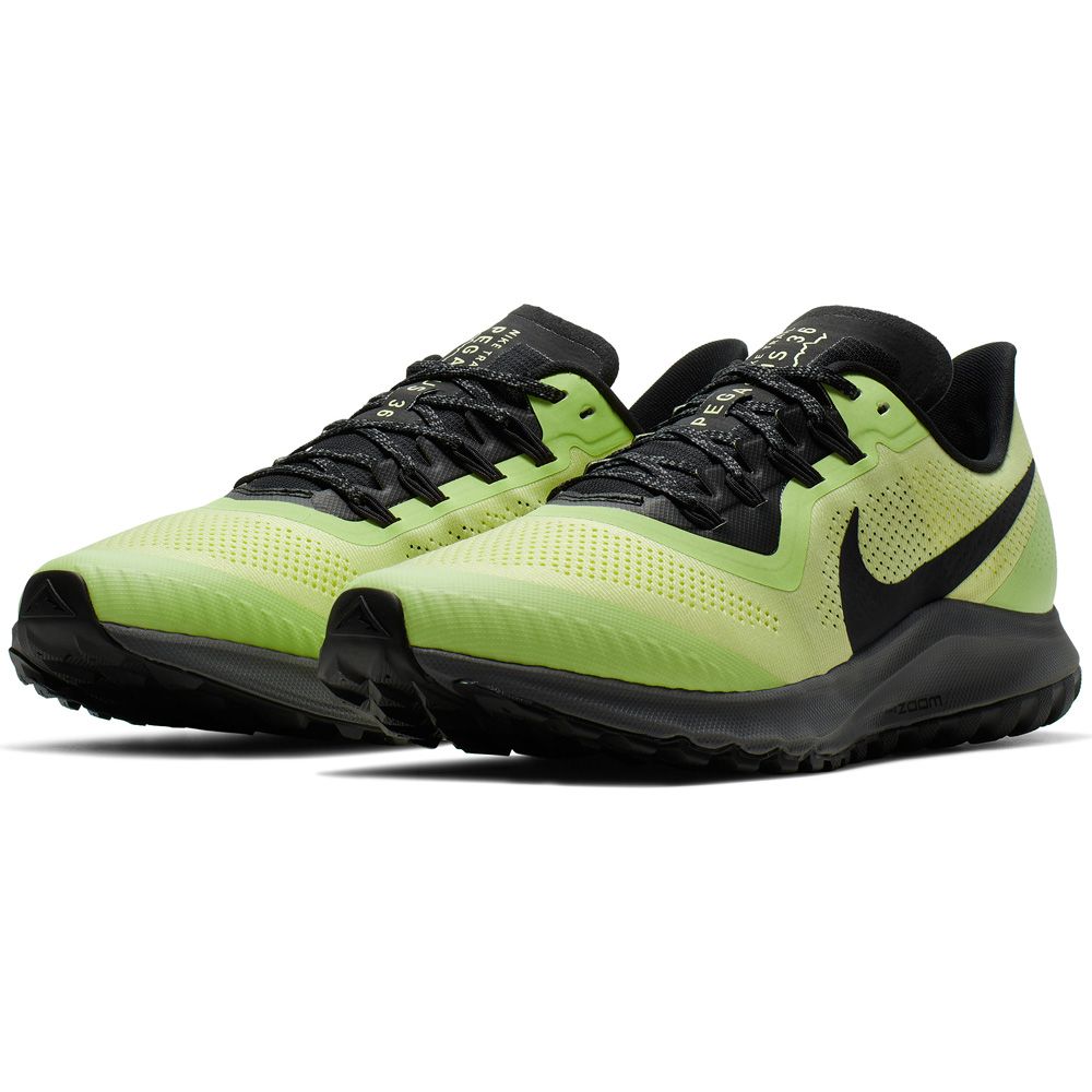green and black running shoes